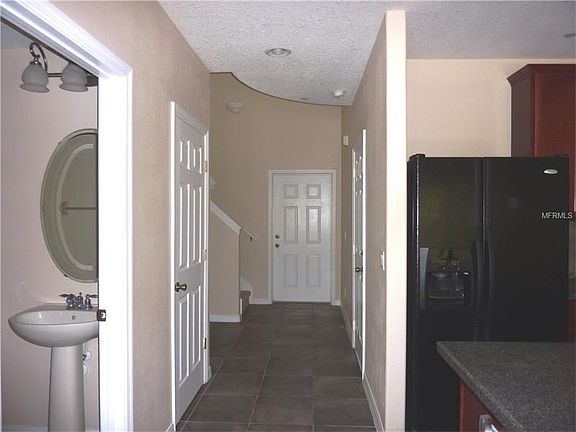 Spacious foyer and downstairs half bath.