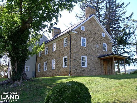 Meticulous Restoration of Stone Exterior with 2 New Stucco Additions