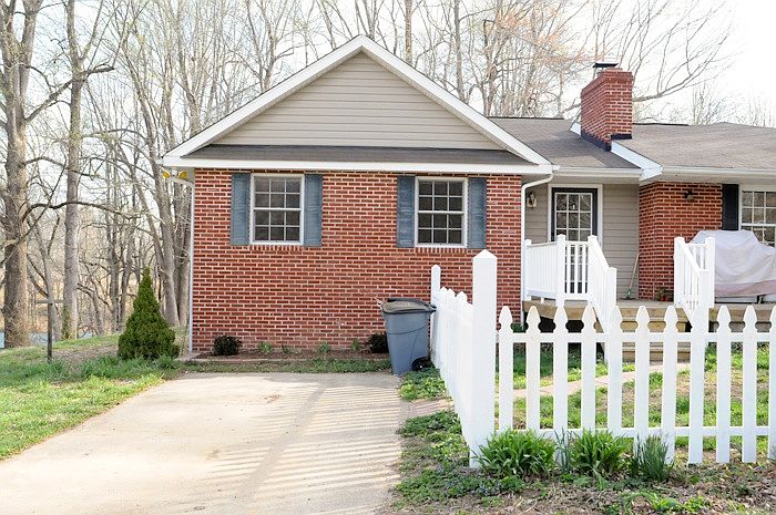 Parking space for apartment. Completely fenced front yard- f