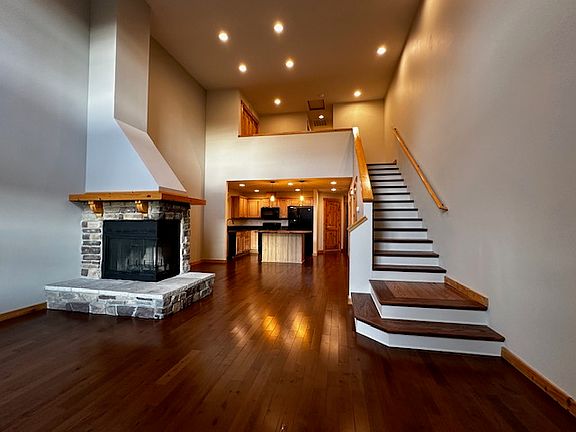 Wood floors and stairs. Kitchen open to dining and living rooms. Loft space upstairs which works well for office space.