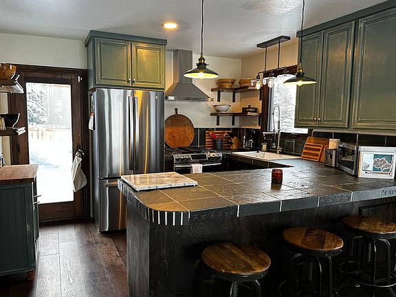 Open concept kitchen with bar seating for 3