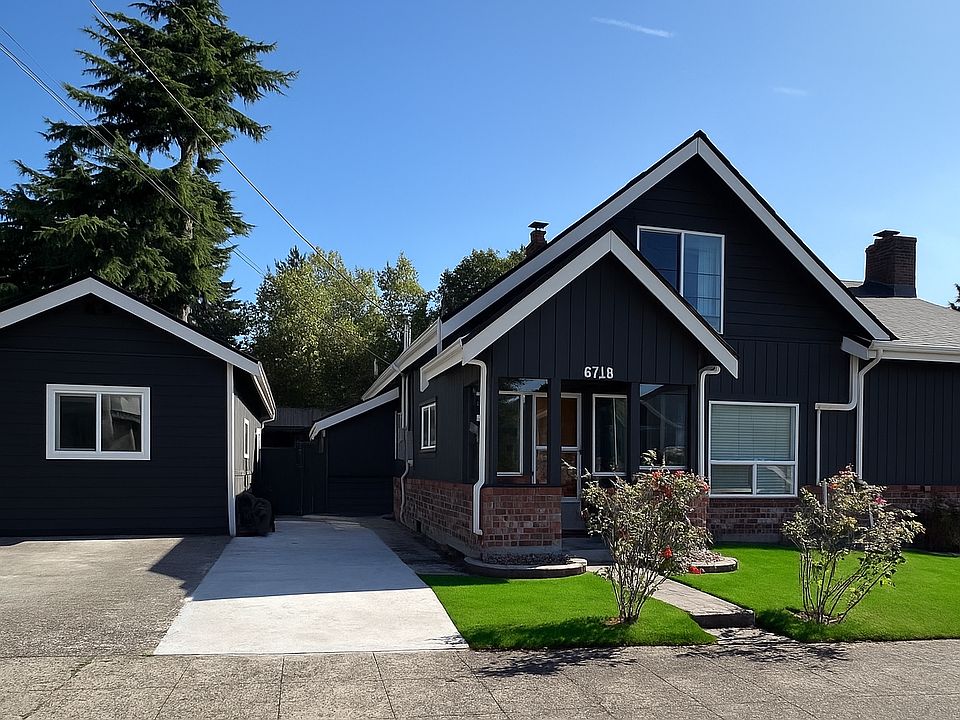 Front of house and driveway with off street parking.