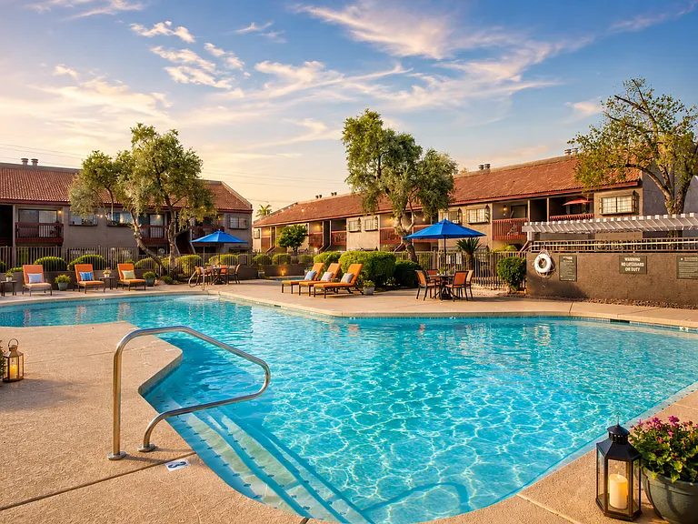 Sunny resort poolside courtyard at dusk
