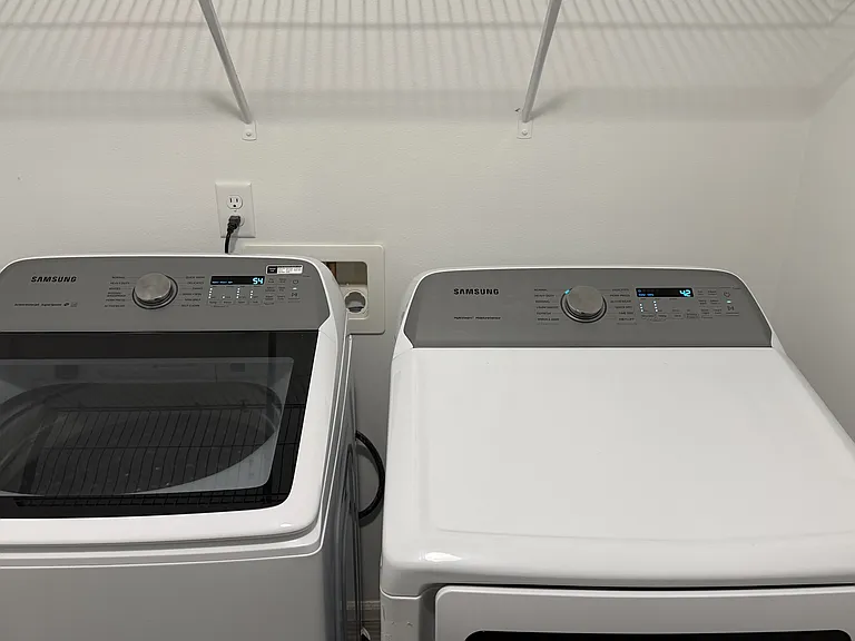 Laundy room with Washer and Dryer Included