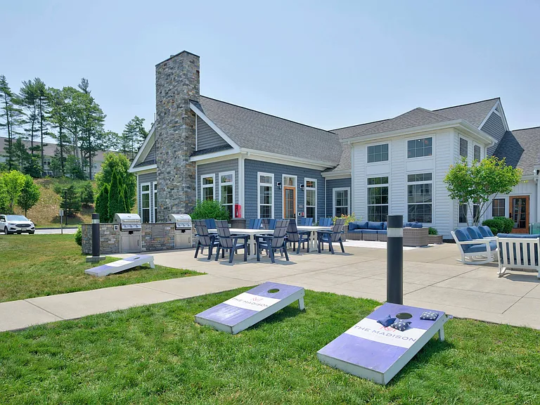 Coastal-Inspired Outdoor Retreat with Fire Pit, Grills & Lawn Games