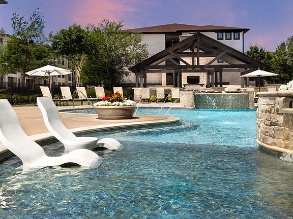 Resort-style pool features outdoor entertaining area