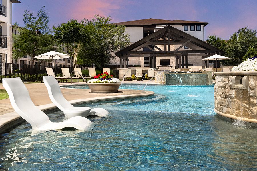 Resort-style pool features outdoor entertaining area