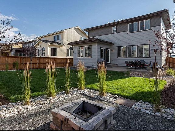 Backyard with extended Patio, Custom Landscape and Fire-Pit