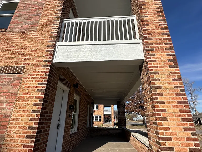 This is the patio that goes to the downstairs unit.