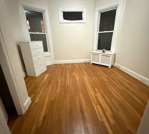 1st Bedroom, large room, hardwood floors, 2 windows, closet