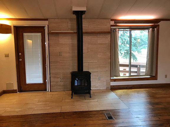 There is a free standing gas stove for added heat in the main living area. The main heat source is central gas heat. A new furnace was installed in November of 2019.