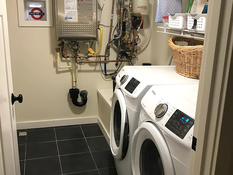 Basement Laundry room and mechanicals for radiant floor heat and on demand hot water
