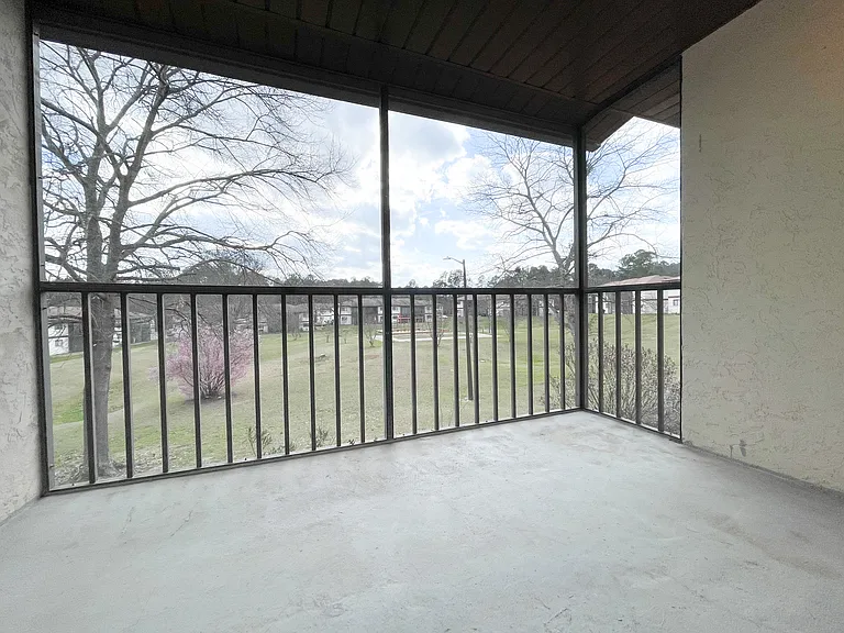 Outdoor patio overlooking beautiful trees.