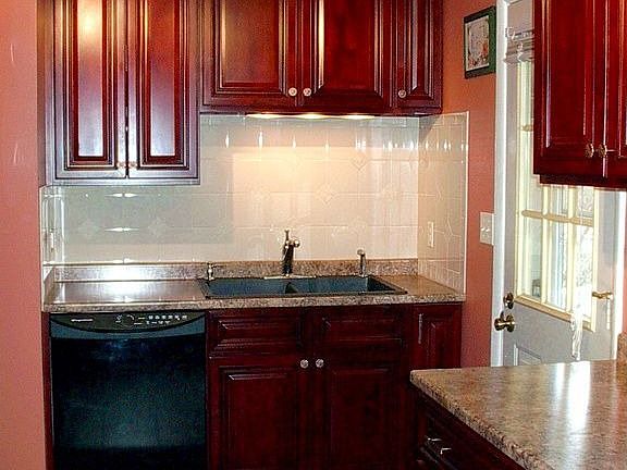 Beautiful cherry-finished maple cabinets, new quiet-clean dishwasher.