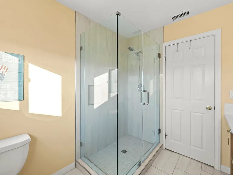 Shower in the glass enclosure.