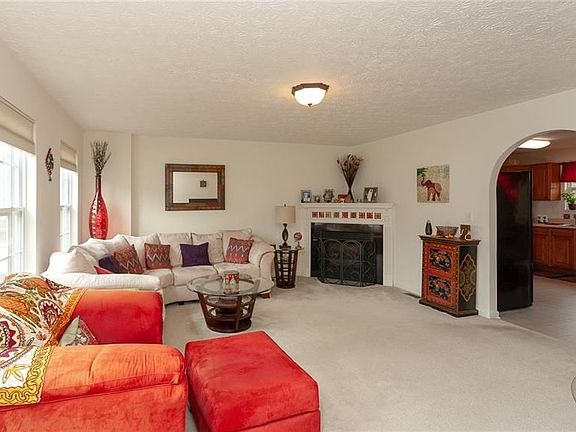 Spacious living room with gas fireplace.