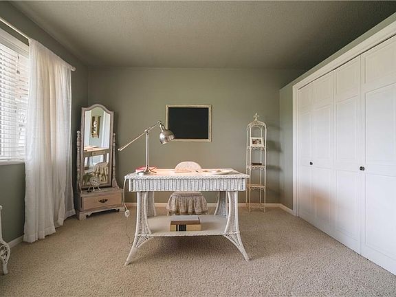 The front sitting room is perfect for reading and writing, or a music room.  The room also has two of these great hidden storage areas for your family and a large display area above for your collectibles.