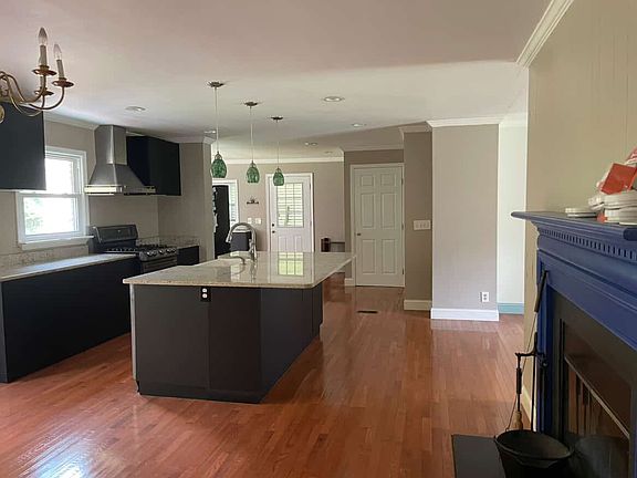 chef kitchen with huge island and pantry.