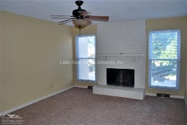Living Room w/wood-burning fireplace