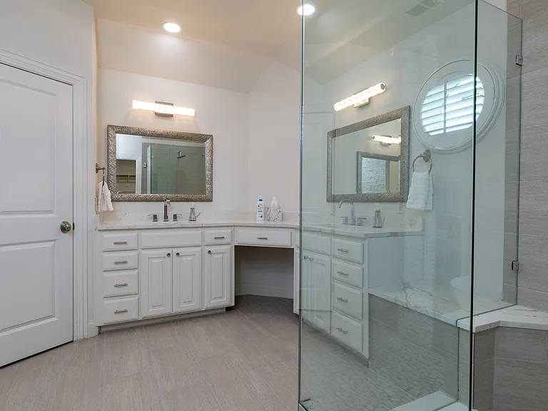 Large double vanity with dual sinks and a makeup station