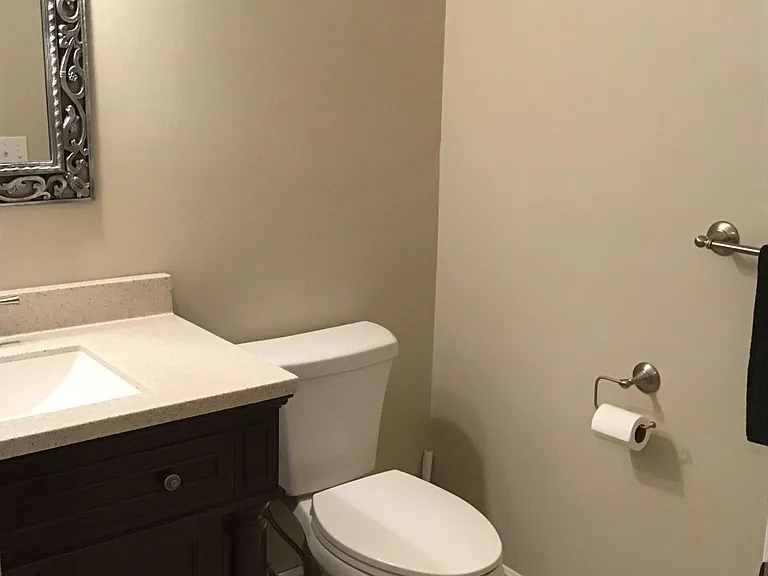 1/2 bath, directly across from main outside entrance