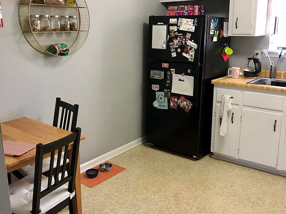 One view of part of the kitchen with eat in area