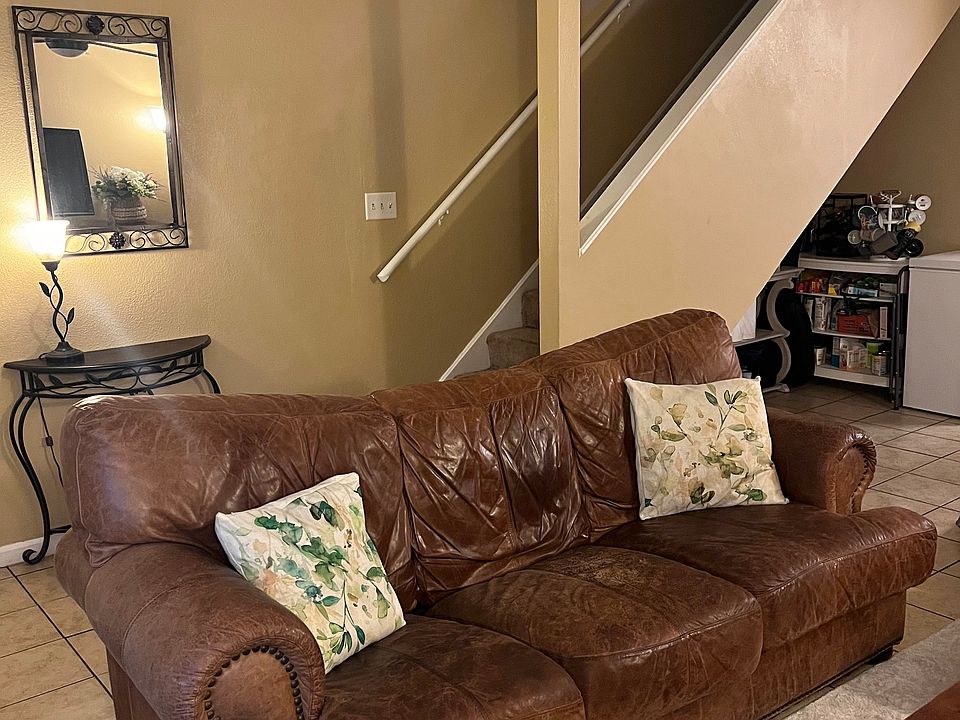 View of the staircase from the living room, as well as view of storage space under the staircase