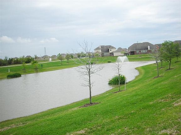 Beautiful lake-view taken through rod-iron back fence.