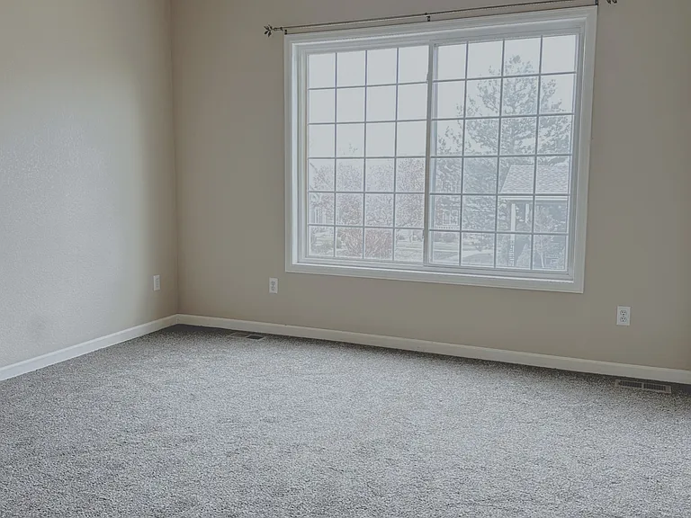 Sunny Main Floor Primary Bedroom!