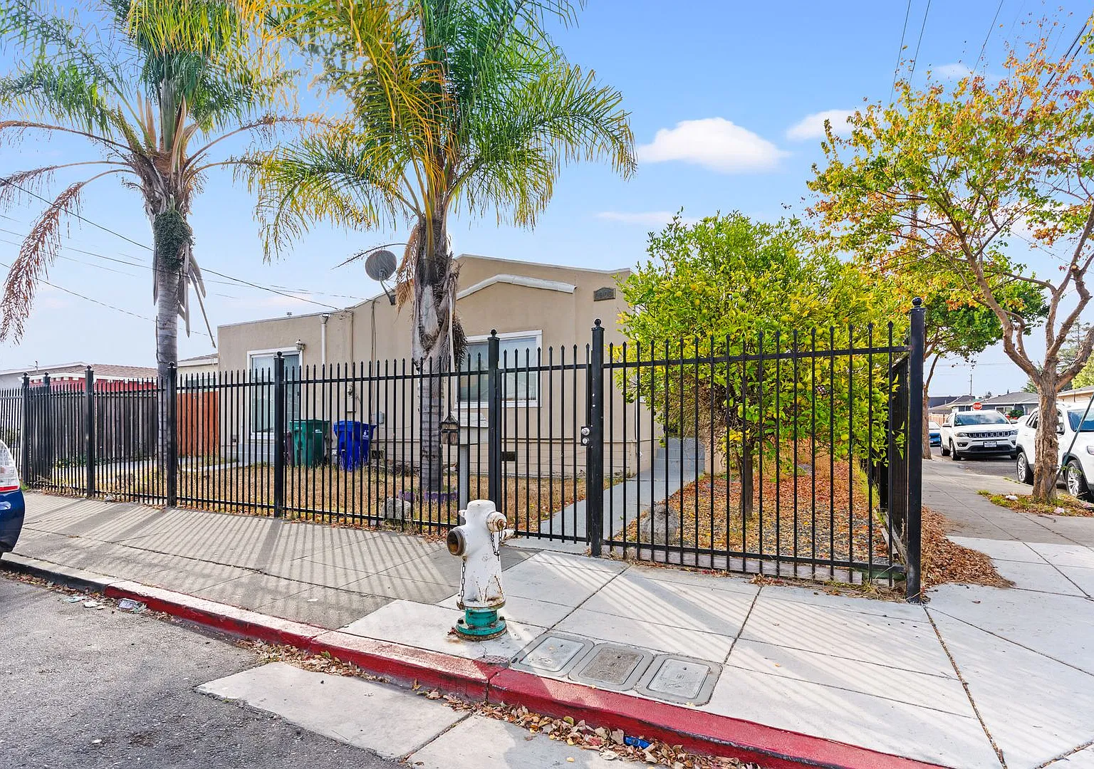 Bright & Updated 2-Bed, 1-Bath Corner-Lot Home | Gated Yard and Driveway — Photo 1