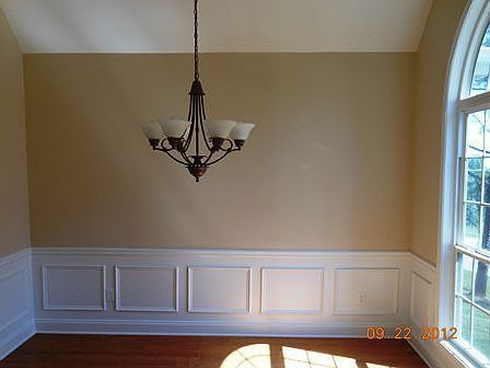 Dining room with vaulted ceiling and huge curved window