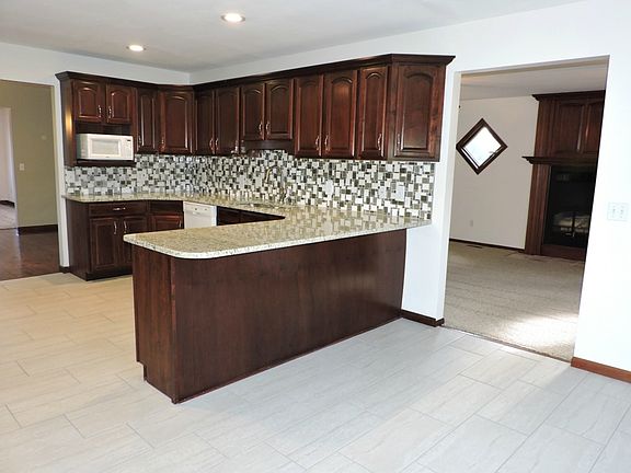 Cherry kitchen with porcelain tile.