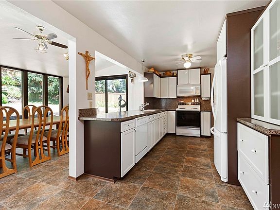 The kitchen opens to the large sun room.