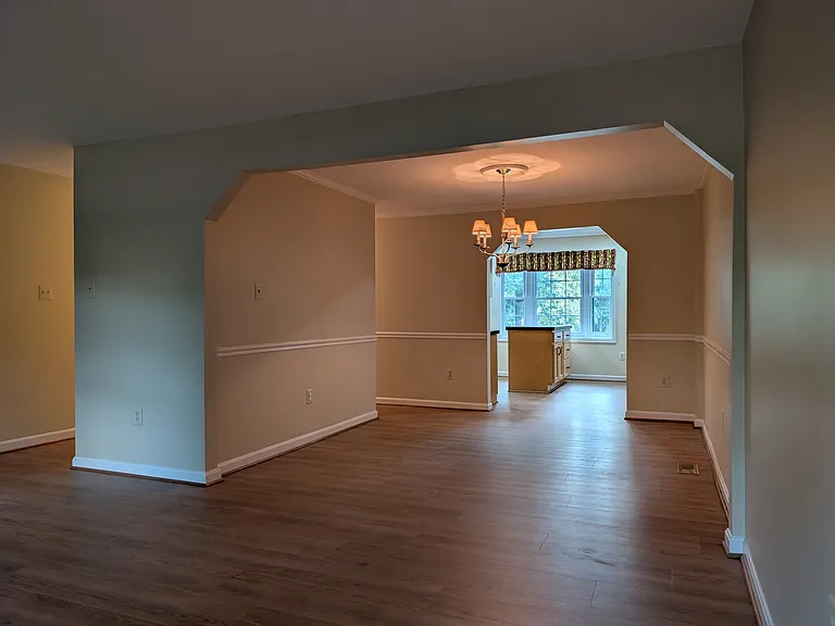 View from living room corner - through dining room and kitchen