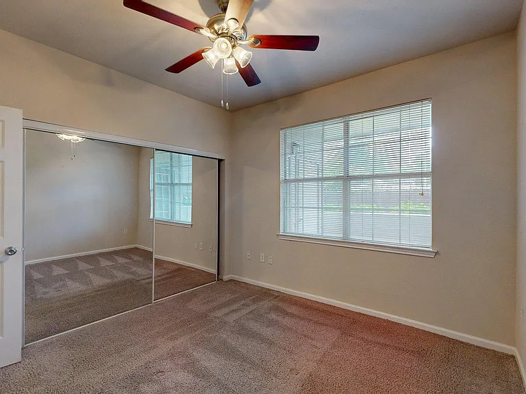 Spacious apartment Bedroom with Carpet Floor.