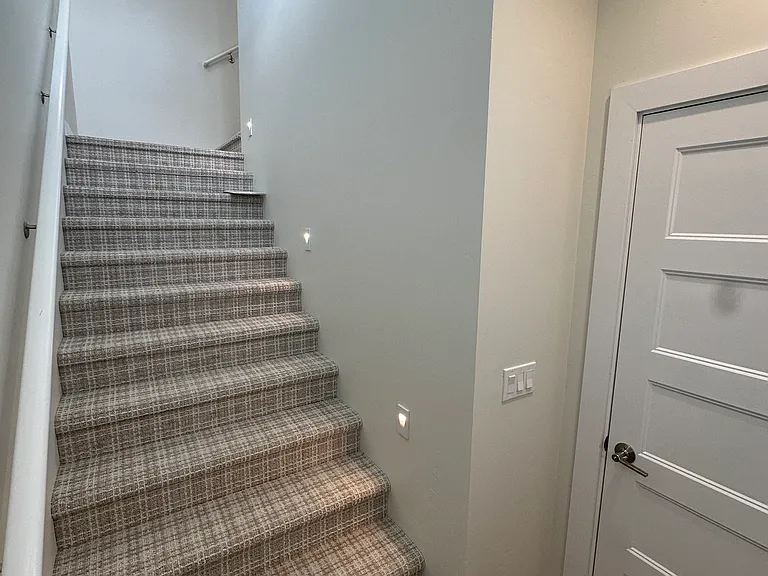 Landing and entrance from front door and attached garage.