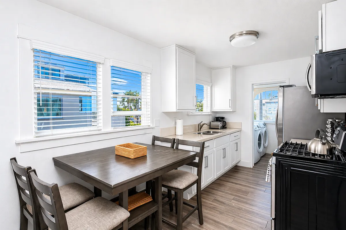 Bright kitchen and dining area with natural light - 1825 W Balboa Blvd #C