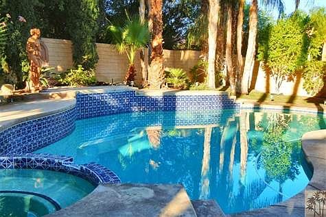 sparkling pool and spa in a resort like setting
