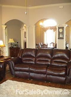 Living Room
						:
						Large living room with arched entry to dining room kitchen and entry hall