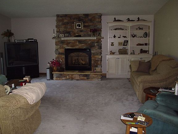 Living room with stone gas fireplace