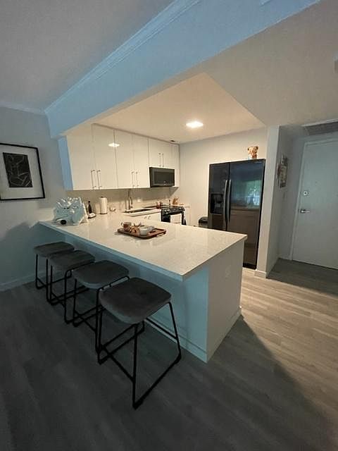 1st image of 100 Edgewater Dr APT 243