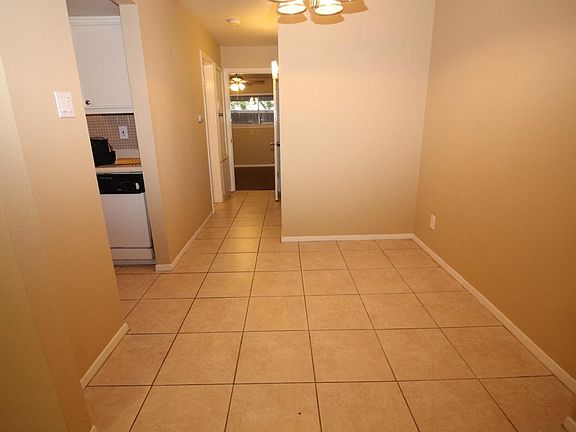 Dining Area with 18" tile flooring and updated light fixture