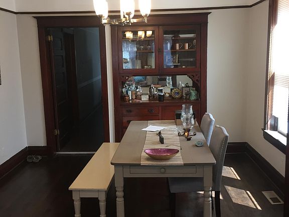 Bright dinning room with build in wood hutch
