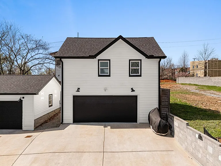 Detached two-car garage with finished studio space above.