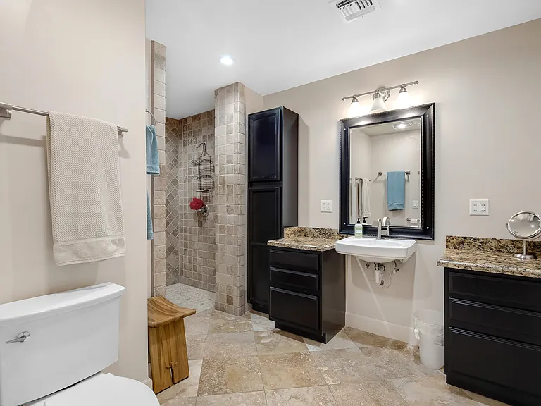 Large bathroom with curbless shower.