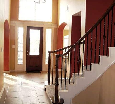 Two story entry with lead glass door for abundant natural light.