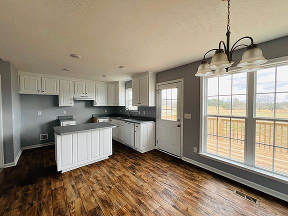 Kitchen/dining area. Double windows provide lots of light, recessed lighting in kitchen area.