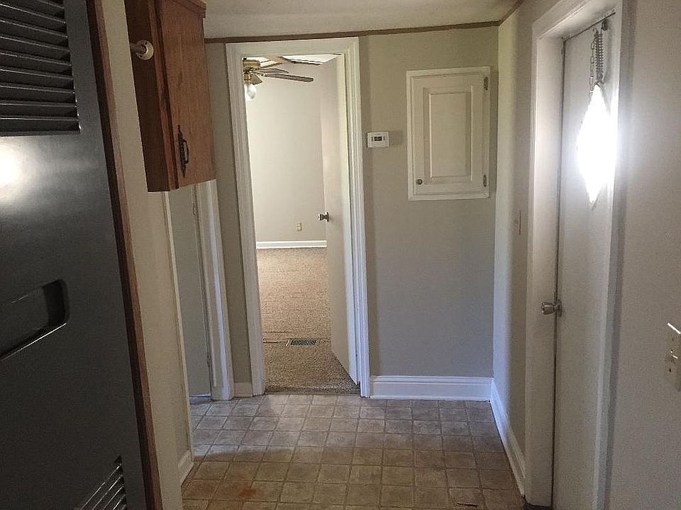 Hallway to master bed / bath