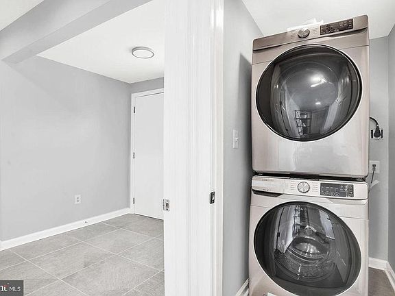 New front-load washer/dryer. Shared laundry room with owner-occupants.