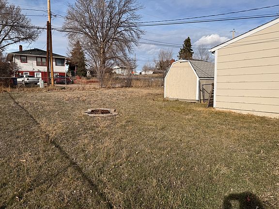 Fenced in yard space, built-in fire pit